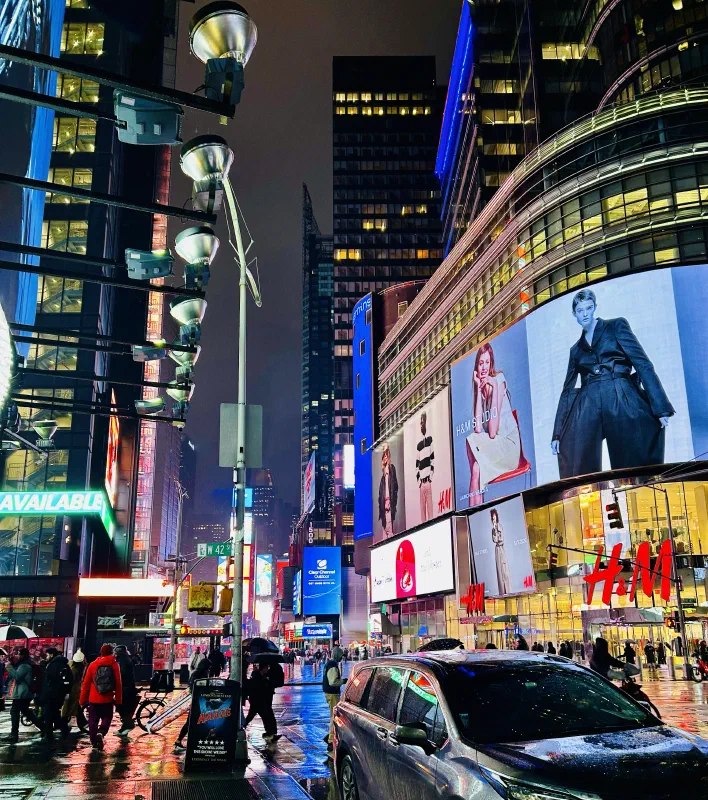 Running to a movie theatre in a rainy Times Square while wolfing down empanadas.